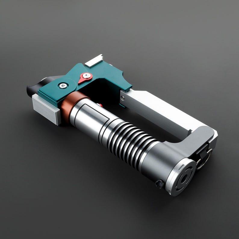 May include: A teal and silver lightsaber with a black and silver handle. The lightsaber is in a folded position, with the blade retracted.