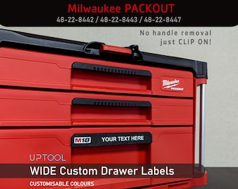 May include: Red Milwaukee Packout tool box with three drawers. The top drawer has a label that says "Milwaukee Packout". The second drawer has a label that says "M18 YOUR TEXT HERE". The bottom drawer has a label that says "UPTOOL WIDE Custom Drawer Labels CUSTOMISABLE COLOURS".
