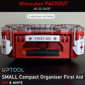 May include: Red and white Milwaukee PACKOUT 48-22-8435 small compact organiser first aid box with a clear lid and a white label that says "FIRST AID".