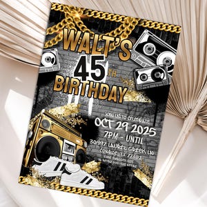 May include: A birthday invitation with a retro hip-hop theme. The invitation features the text "Walt's 45th Birthday" with a boombox, cassette tapes, and gold chain accents. The date and time of the party are also included.