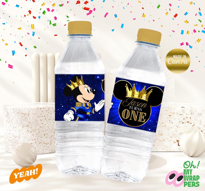 May include: Two clear plastic water bottles with blue and gold labels featuring a cartoon Mickey Mouse dressed as a prince. The labels say "Jason Turns One".