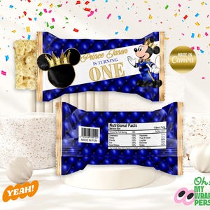 May include: A blue and gold party favour wrapper with a Mickey Mouse character dressed as a prince. The wrapper says "Prince Jason is turning one".