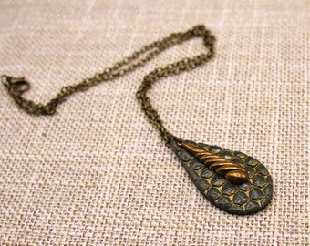 Polymer clay teardrop pendant with brass accent