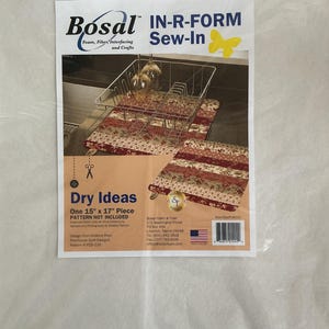 May include: A white Bosal In-R-Form Sew-In foam sheet in clear plastic packaging. The label features the text Dry Ideas, One 15 inch by 17 inch Piece, and an image of a wire dish rack on a floral fabric mat. Includes company contact details.