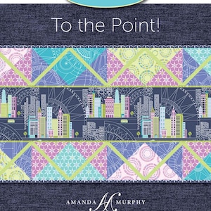 May include: A colorful fabric design with the text "Serge-Ahead!" and "To the Point!" The design features a cityscape, geometric patterns, and the designer's name. The color palette includes blue, teal, pink, and green.