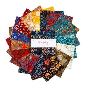 May include: A collection of colorful fabric squares arranged in a circular pattern. The fabrics feature various patterns and colors, including red, blue, yellow, and black. A white label in the center reads "Places you'll go".