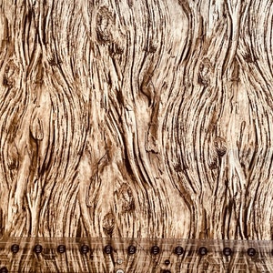 May include: Close-up of a brown and white woodgrain pattern. The woodgrain has a natural, rustic look with knots and swirls.