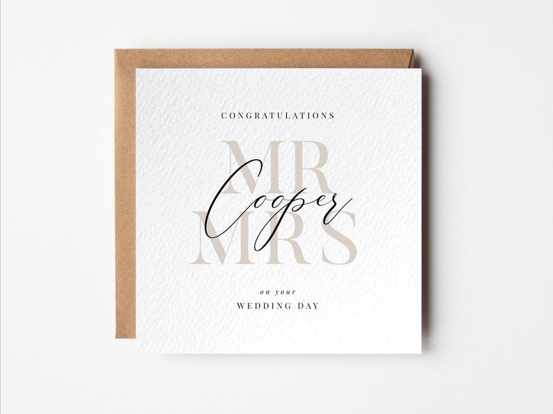 Square white wedding card with Mr and Mrs in large beige letters. Across the centre is the personalised surname in black. The card reads, congratulations on your wedding day.