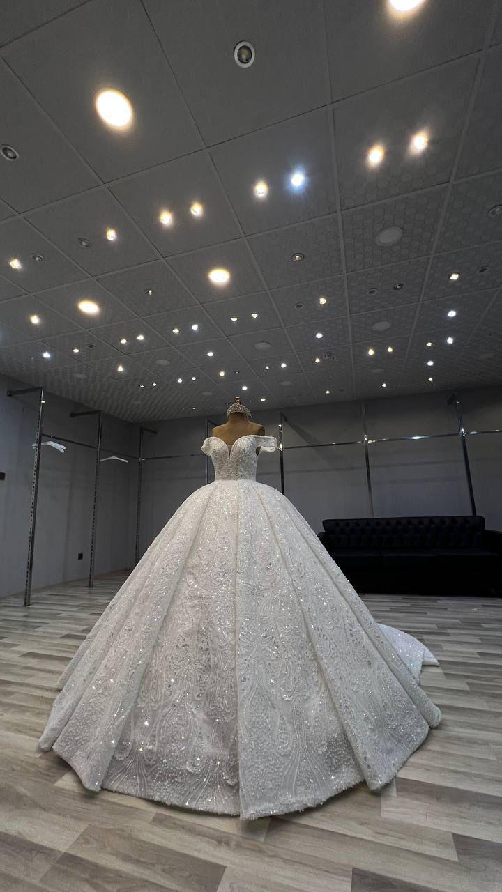 Elegant Luxury Bridal Gown with Handcrafted Embroidery and Modern Silhouette