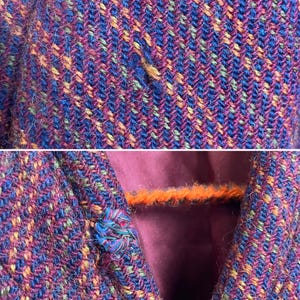 May include: A textured fabric garment featuring a multi-colored herringbone weave in shades of deep blue, magenta, orange, and green. The material has a visible fuzzy surface texture. A single round fabric-covered button is attached to the front.