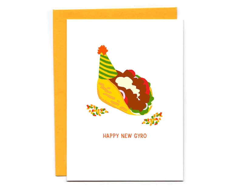 May include: A greeting card with a cartoon illustration of a gyro in a pita bread wearing a party hat. The text on the card reads "Happy New Gyro".