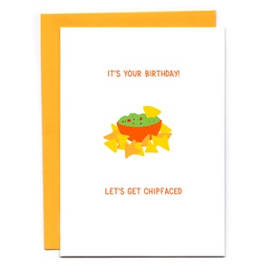 May include: A white card with the text "It's your birthday!" and "Let's get chipfaced" in black. A cartoon illustration of a bowl of guacamole and chips is in the center of the card.