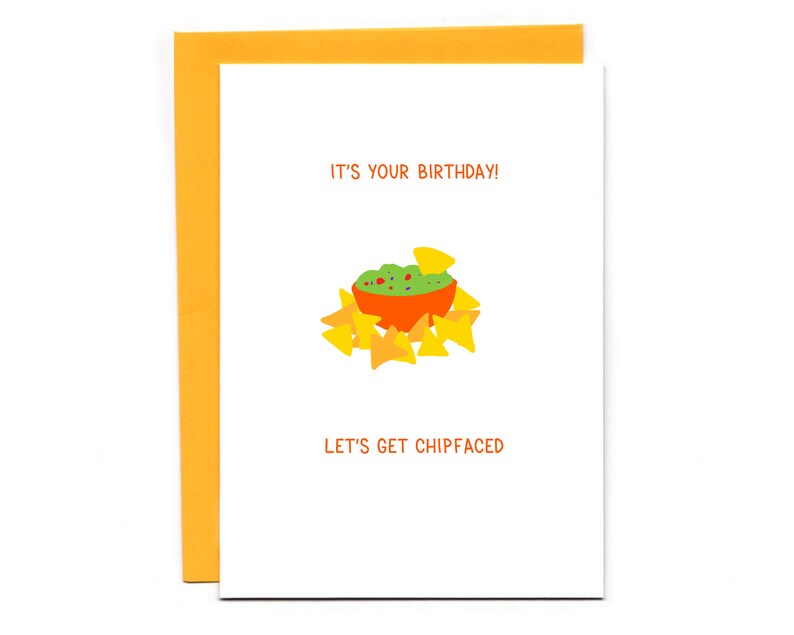 May include: A white card with the text "It's your birthday!" and "Let's get chipfaced" in black. A cartoon illustration of a bowl of guacamole and chips is in the center of the card.