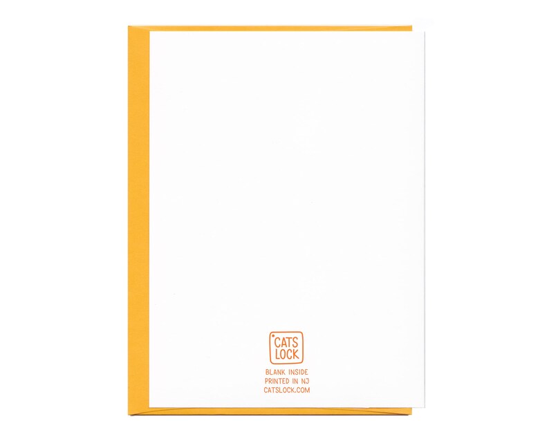 May include: Blank greeting card with a yellow border and a small, orange rectangle in the bottom right corner with the text "CATS LOCK" in white, "BLANK INSIDE" in black, "PRINTED IN NJ" in black, and "CATSLOCK.COM" in black.