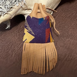 May include: A set of three ceramic mugs with a speckled, matte finish. The mugs are in shades of cream, light gray, and dark gray. Each mug has a simple, minimalist design, perfect for coffee or tea.