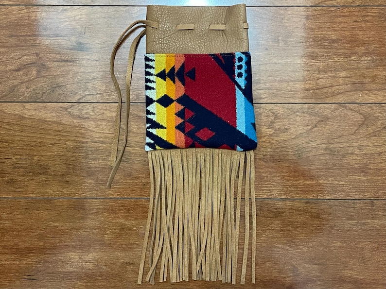 May include: A set of three ceramic mugs with a speckled, matte finish. The mugs are in shades of cream, light brown, and dark brown. Each mug has a simple, minimalist design, perfect for coffee or tea.