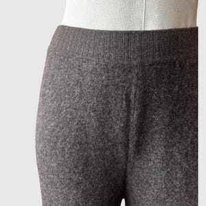 May include: Grey marl leggings with a ribbed waistband.