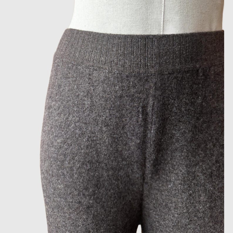 May include: Grey marl leggings with a ribbed waistband.