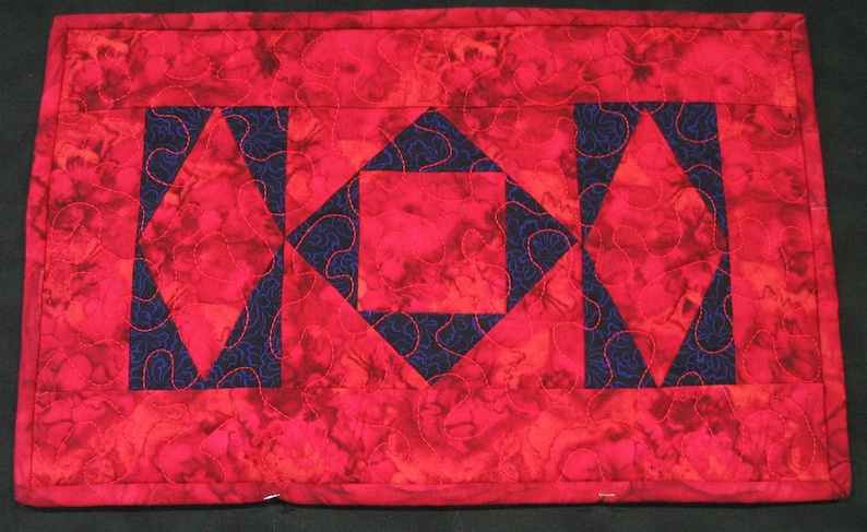 Red and purple batik diamonds placemat
