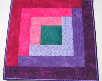 Purple and pink log cabin plate mat