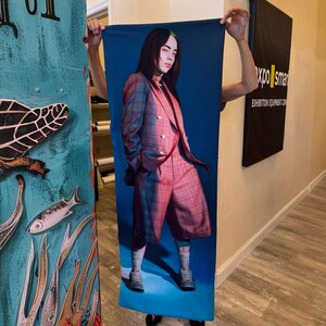 Custom Body Pillowcase a person holding up a picture of a woman on a skateboard