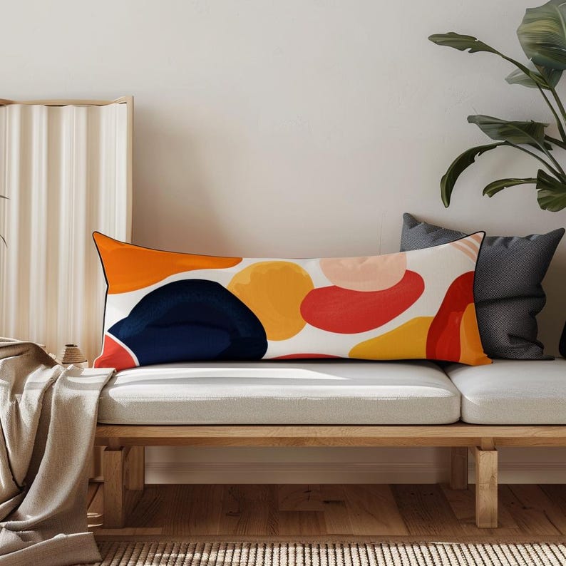 Custom Body Pillowcase a white couch with a colorful pillow on top of it
