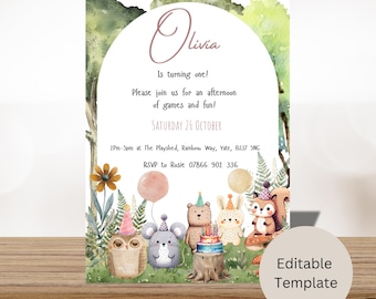 May include: A woodland-themed first birthday party invitation with a watercolor background. The invitation features a pink and white balloon, a brown bear wearing a party hat, a white rabbit wearing a party hat, a gray mouse wearing a party hat, a brown owl wearing a party hat, and a squirrel wearing a party hat. The text on the invitation reads "Olivia is turning one! Please join us for an afternoon of games and fun! Saturday 26 October 2pm-5pm at The Playshed, Rainbow Way, Yate, BS37 5NG RSVP to Rosie 07866 902 336".