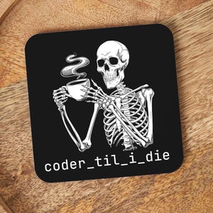 May include: Black and white illustration of a skeleton holding a cup of coffee with steam rising from it. The text "coder_til_i_die" is below the skeleton.