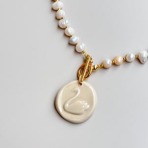 SWAN N PEARLS | Freshwater Pearl Necklace with Handmade Ceramic Swan Pendant