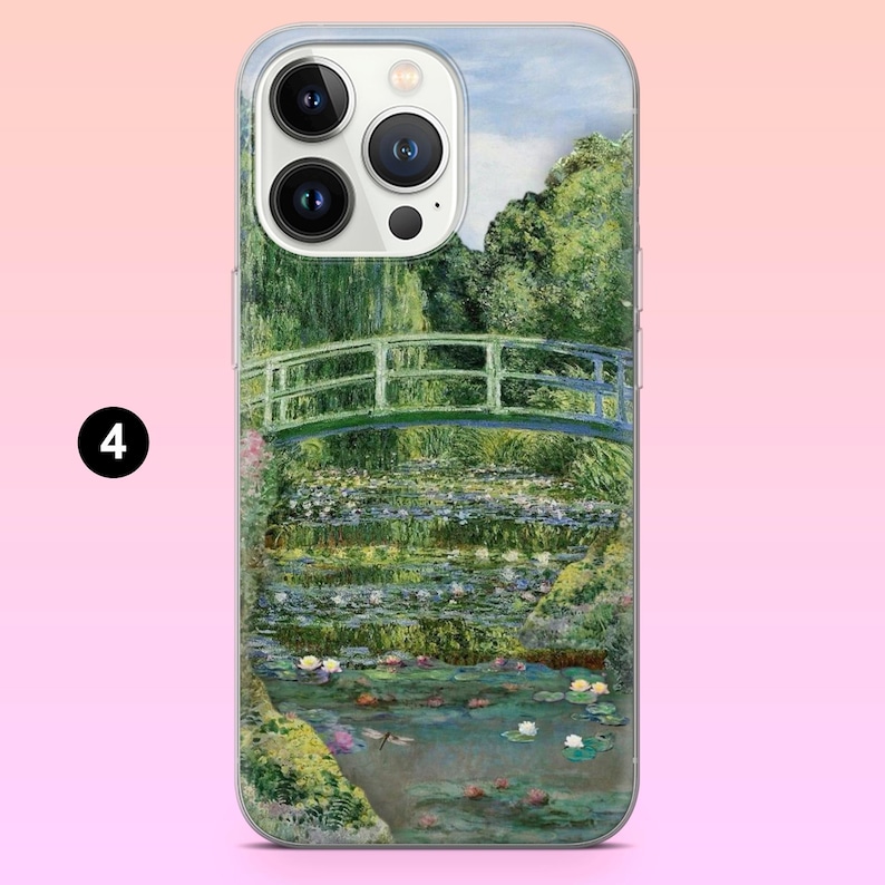May include: A phone case with a painting of a green bridge over a pond with water lilies. The phone case has a clear back and a white front with a camera lens.