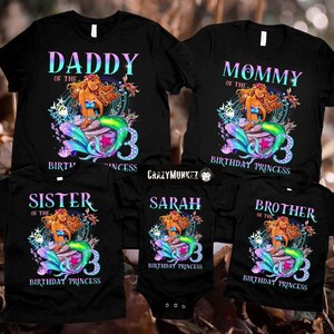 May include: A set of five black t-shirts with a mermaid graphic and the text "Daddy of the Birthday Princess", "Mommy of the Birthday Princess", "Sister of the Birthday Princess", "Sarah Birthday Princess", and "Brother of the Birthday Princess".
