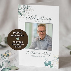 May include: A folded funeral program card featuring a white background with green eucalyptus leaf illustrations. The text reads Celebrating the life of Nathan Riley 28.05.1957 - 20.09.2025. A central rectangular frame displays a photo of a man wearing glasses.