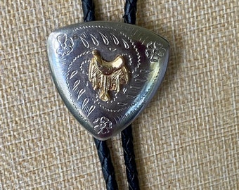 Vintage Gold Saddle Bolo Tie Black Woven Leather Cord Silver Etched Buckle Tips Western Cowboy Style