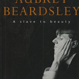 Peut inclure: Couverture de livre avec le titre "AUBREY BEARDSLEY" en lettres orange et le sous-titre "A slave to beauty". Un portrait en noir et blanc d'un homme est à droite. Le nom de l'auteur, "DAVID COLVIN", est en bas.