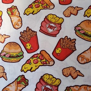 May include: A white fabric with a repeating pattern of cartoon fast food items. The design includes burgers, pizza slices, french fries in red containers with smiley faces, chicken wings, burritos, and bags of chips.