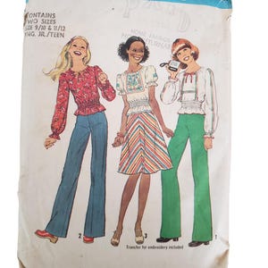 May include: Vintage Simplicity sewing pattern featuring illustrations of three women in 1970s outfits. The pattern includes two sizes, 9/10 and 11/12, for young junior/teen sizes. The pattern is for home fabrics and includes a transfer for embroidery.