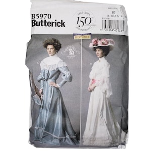 May include: A Butterick sewing pattern package, B5970, featuring illustrations of historical women's dresses. The package includes text indicating the 150th anniversary of Butterick, with dress designs in blue and white.