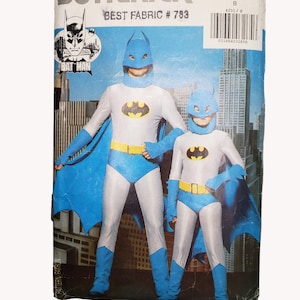 May include: A vintage Butterick sewing pattern for Batman costumes. The pattern features illustrations of two figures in Batman suits with blue capes, masks, and gloves. The costumes have a yellow belt and the Batman logo on the chest. The pattern number is 4201.