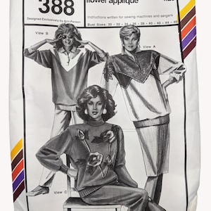 May include: A white sewing pattern envelope for Stretch & Sew 388, featuring illustrations of three garments: a rugby shirt, a shirt with flower appliqué, and a sweater with floral designs. Text includes bust sizes 30 to 46 and instructions.
