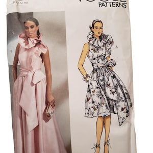 May include: Vogue Patterns dressmaking pattern featuring a pink formal gown and a patterned cocktail dress. The pattern includes the text "VOGUE PATTERNS" and "BADGLEY MISCHKA". The pattern size is indicated as 0-12-14-16.