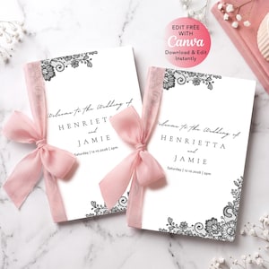 May include: Two white wedding programs featuring black lace floral borders, black serif text reading Welcome to the Wedding of HENRIETTA and JAMIE, and a date of Saturday | 12.10.2026. Each card is tied with a sheer dusty pink chiffon ribbon bow.