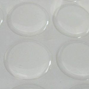 May include: A sheet of clear, round, adhesive stickers. The stickers are arranged in a grid pattern.