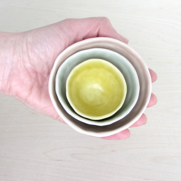 Pinched Porcelain Garnish Nesting Bowls in Peachy Pink, Sage Green, and Mustard Yellow