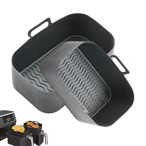May include: Two black silicone air fryer liners with handles. The liners have a square shape with a wavy pattern on the base. The liners are designed to fit inside an air fryer basket. The liners are made of a flexible, heat-resistant material.