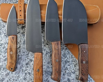 May include: Four black chef knives with wooden handles. The knives are arranged in a row on a gray countertop. The knives are all different sizes and shapes. The knives are sharp and have a polished finish.