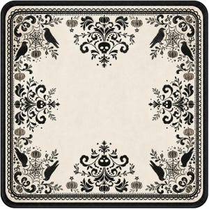 May include: A square mat featuring a cream-colored center and a black border. The design includes black damask patterns with skulls, crows, spiderwebs, and pumpkins arranged symmetrically around the edges in a repeating decorative motif.