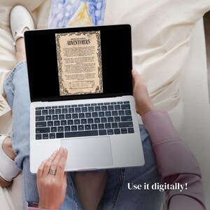 May include: A laptop computer with a black screen displaying a vintage document with the text "WRECK AND BARBARIAN ADVENTURERS". The document is framed with a decorative border. The laptop is on a person's lap, and the person's hands are visible on the keyboard and trackpad. The text "Use it digitally!" is visible at the bottom of the image.
