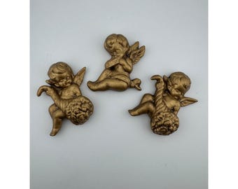 Juego de 3 figuras de querubines de cerámica vintage dorados para decoración de pared.