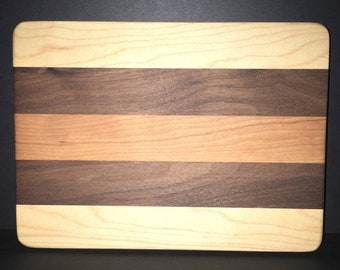 7” X 9” X 1” Custom Made Cutting Board Created Out Of Cherry, Black Walnut, and Maple