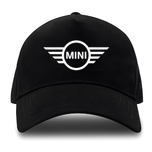 May include: A black baseball cap with a white Mini Cooper logo featuring the word "MINI" in a circle with wings.